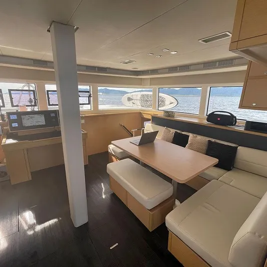  Yacht Photos Pics Interior of 2016 Lagoon 52 yacht with modern seating and navigation area.