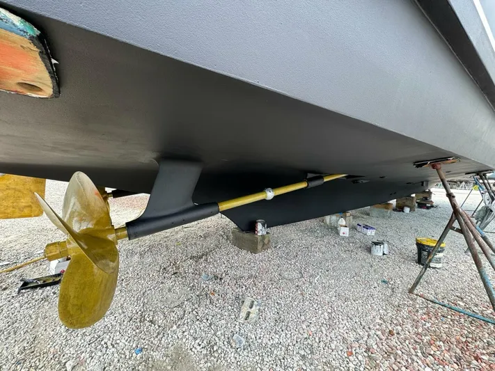 Moonshine Yacht Photos Pics 1985 Hatteras Enclosed Bridge yacht underbody with propeller and shaft on dry dock.