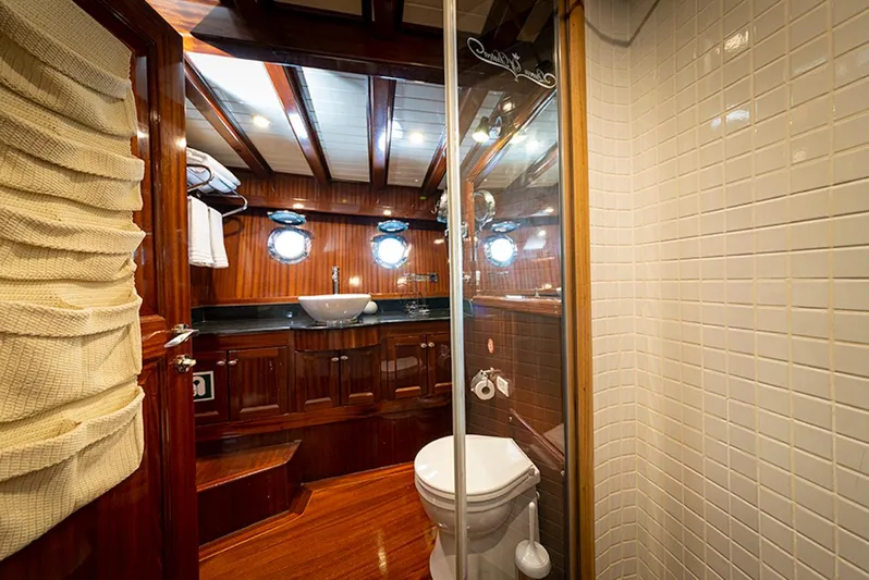  Yacht Photos Pics Luxurious 2009 custom motorsailer bathroom with wooden interior and modern fixtures.