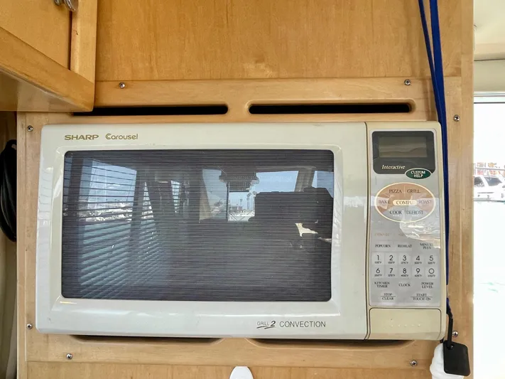 Salty Yacht Photos Pics Built-in Sharp Carousel microwave in a 1999 Californian 39 yacht kitchen.