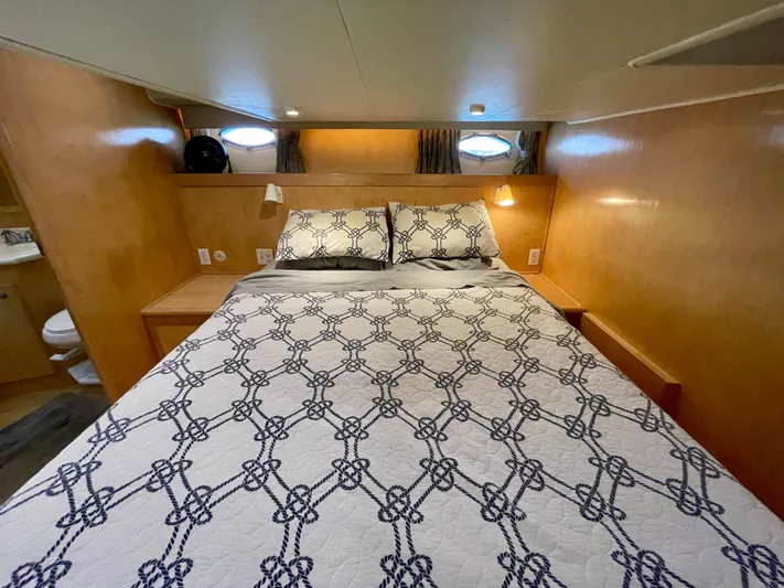 Salty Yacht Photos Pics Cozy bedroom in a 1999 Californian 39 yacht with nautical-themed bedding.