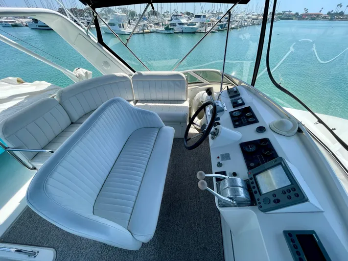 Salty Yacht Photos Pics 1999 Californian 39 yacht cockpit with white seating and modern navigation equipment.