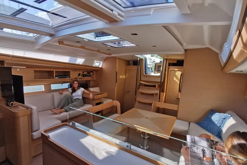  Yacht Photos Pics Luxurious interior of 2020 Dufour 56 Exclusive yacht with modern furnishings and skylights.