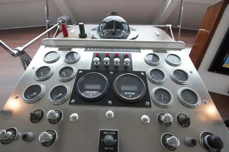  Yacht Photos Pics 1963 Huckins Linwood boat dashboard with gauges, RPM meters, and control switches.