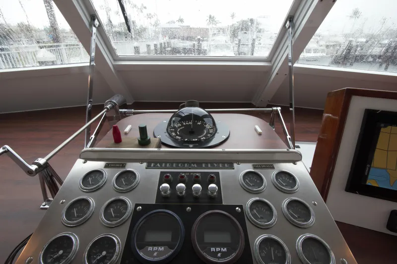  Yacht Photos Pics 1963 Huckins Linwood boat dashboard with gauges and navigation equipment.