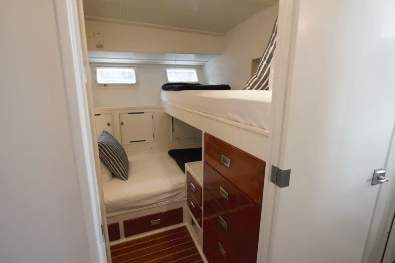  Yacht Photos Pics 1963 Huckins Linwood yacht cabin with bunk beds and wooden storage drawers.