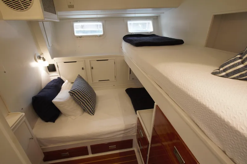  Yacht Photos Pics Cozy 1963 Huckins Linwood yacht cabin with bunk beds and nautical decor.