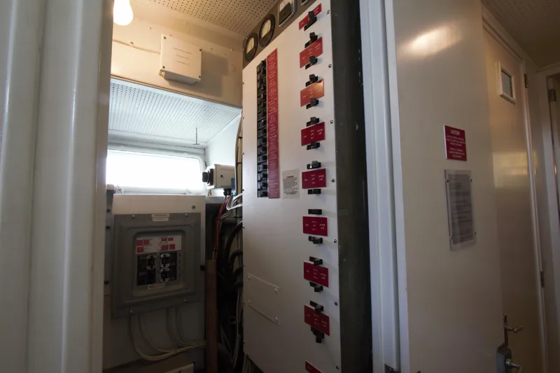  Yacht Photos Pics Electrical panel inside 1963 Huckins Linwood boat, featuring switches and wiring.