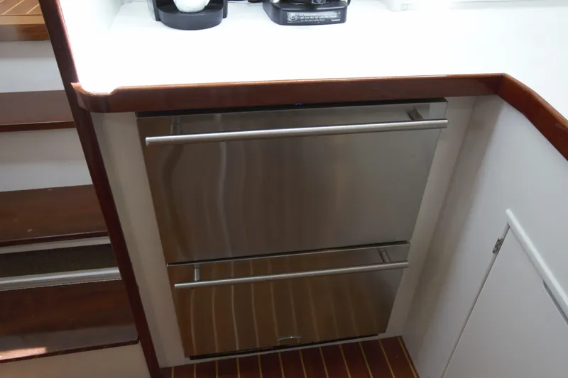  Yacht Photos Pics Stainless steel drawers in 1963 Huckins Linwood yacht interior, featuring wooden accents.