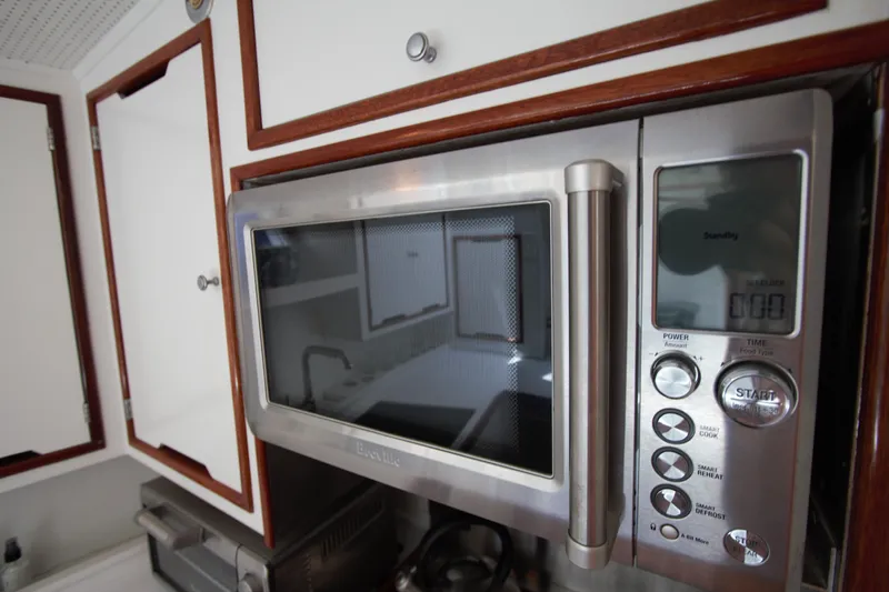  Yacht Photos Pics Stainless steel microwave in 1963 Huckins Linwood kitchen interior.