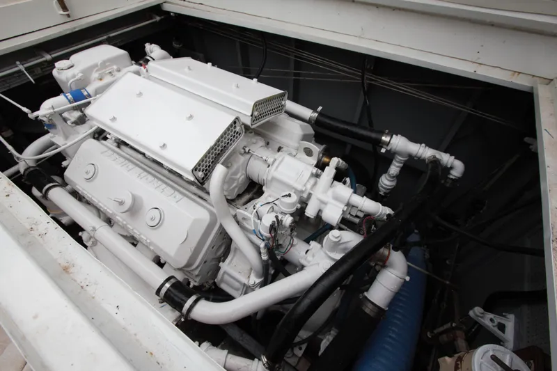  Yacht Photos Pics Engine compartment of a 1963 Huckins Linwood boat, showcasing detailed mechanical components.