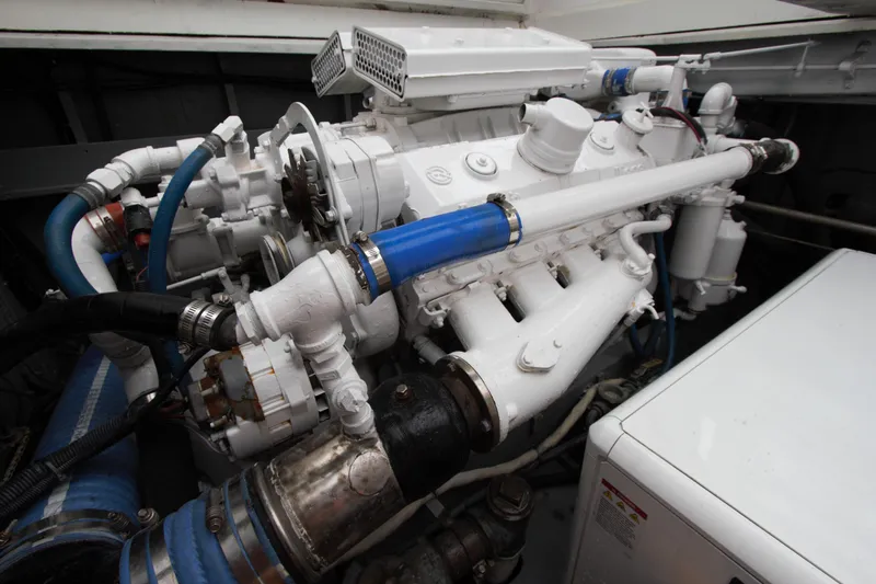  Yacht Photos Pics Engine room of a 1963 Huckins Linwood boat, featuring complex machinery and piping.