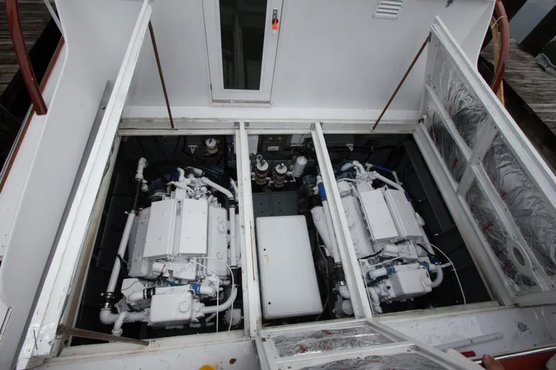  Yacht Photos Pics Engine compartment of a 1963 Huckins Linwood boat, showcasing dual engines.