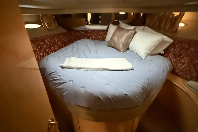  Yacht Photos Pics Cozy bedroom interior of 1998 Sea Ray 540 Sundancer yacht with plush bedding.