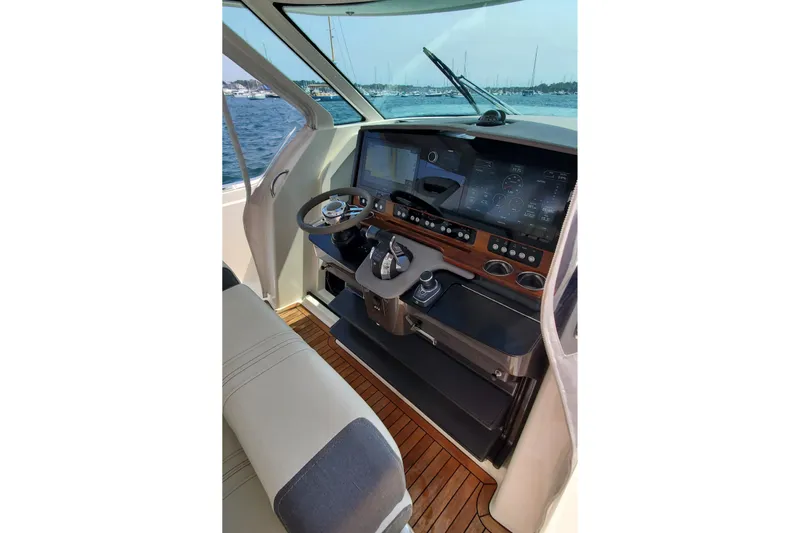 Pouge Life Yacht Photos Pics 2021 Tiara Sport 38 LS helm with modern controls and navigation screens.