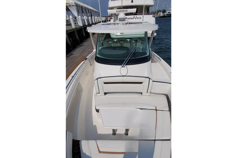 Pouge Life Yacht Photos Pics 2021 Tiara Sport 38 LS boat docked, showcasing sleek design and spacious seating.