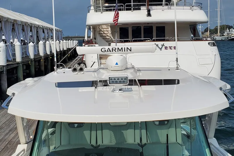 Pouge Life Yacht Photos Pics 2021 Tiara Sport 38 LS yacht docked, featuring Garmin equipment on the roof.