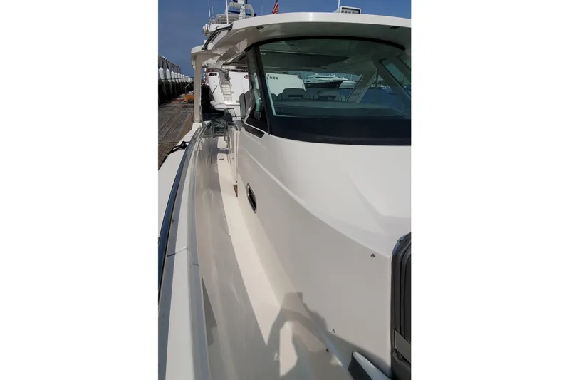 Pouge Life Yacht Photos Pics 2021 Tiara Sport 38 LS yacht side view, docked at marina.