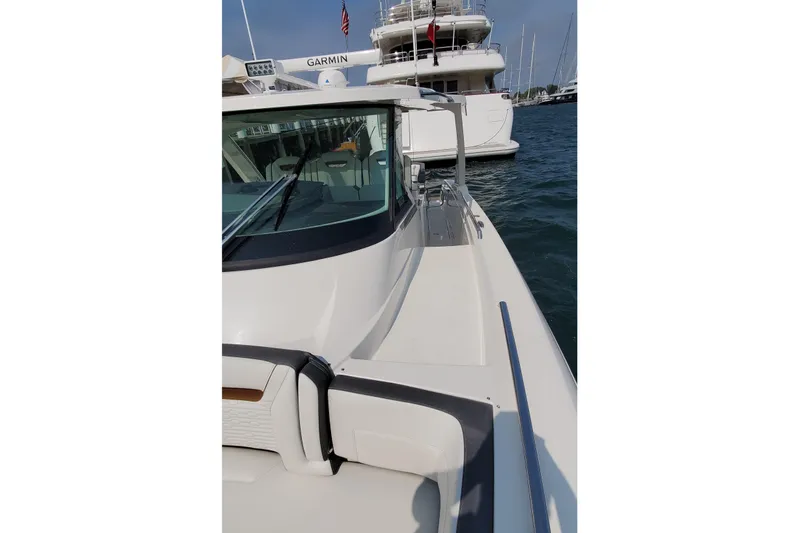 Pouge Life Yacht Photos Pics 2021 Tiara Sport 38 LS boat docked, showcasing sleek design and modern features.