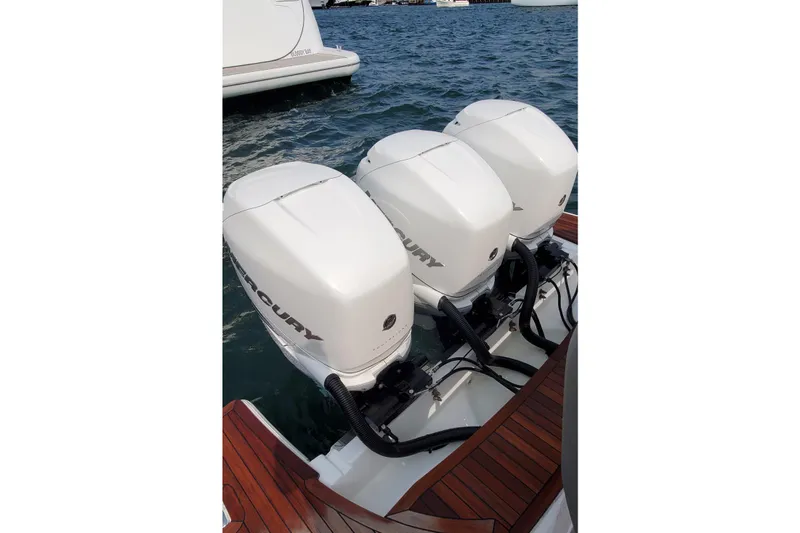 Pouge Life Yacht Photos Pics Triple Mercury outboard engines on a 2021 Tiara Sport 38 LS boat.