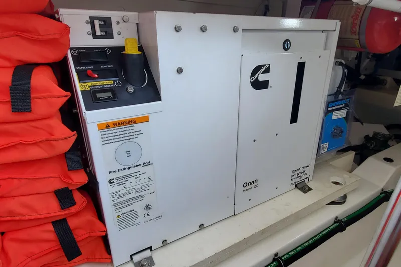 Pouge Life Yacht Photos Pics Cummins Onan Marine QD generator in 2021 Tiara Sport 38 LS boat engine room.