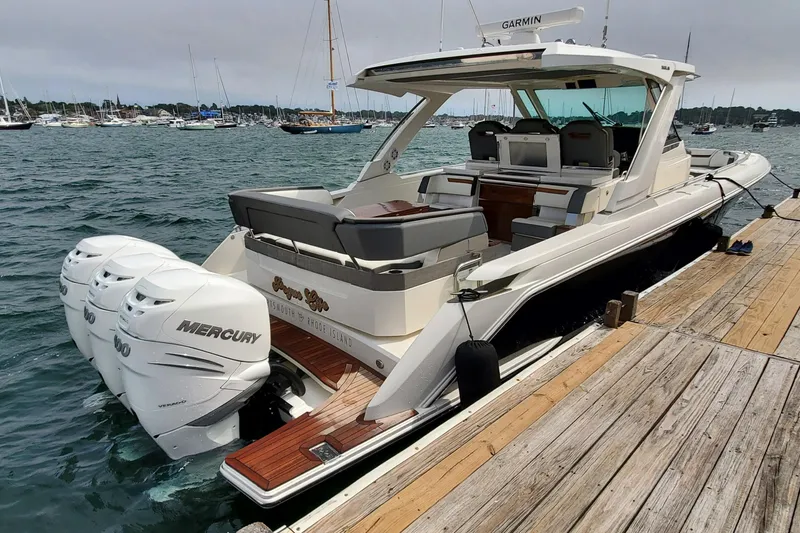 Pouge Life Yacht Photos Pics 2021 Tiara Sport 38 LS boat docked, featuring triple Mercury engines.