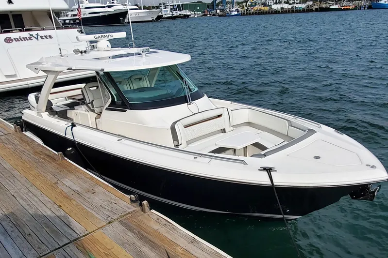 Pouge Life Yacht Photos Pics 2021 Tiara Sport 38 LS boat docked at marina, featuring sleek design and modern amenities.