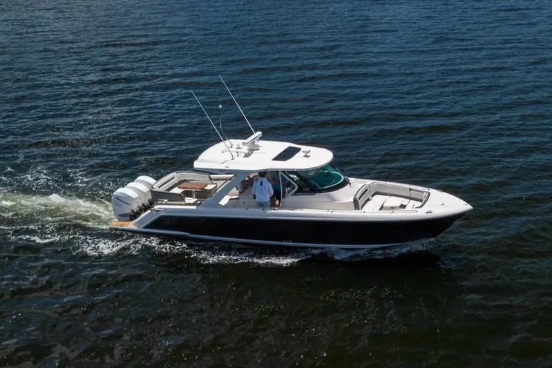 Pouge Life Yacht Photos Pics 2021 Tiara Sport 38 LS cruising on open water, showcasing sleek design and performance.