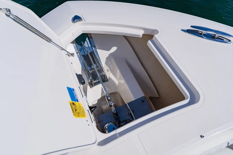 Blue Skies Yacht Photos Pics 2022 Pursuit S 378 Sport boat anchor compartment detail.