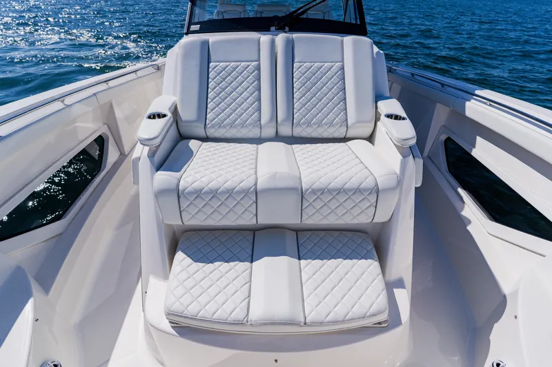 Blue Skies Yacht Photos Pics Luxurious seating on 2022 Pursuit S 378 Sport boat with quilted upholstery.