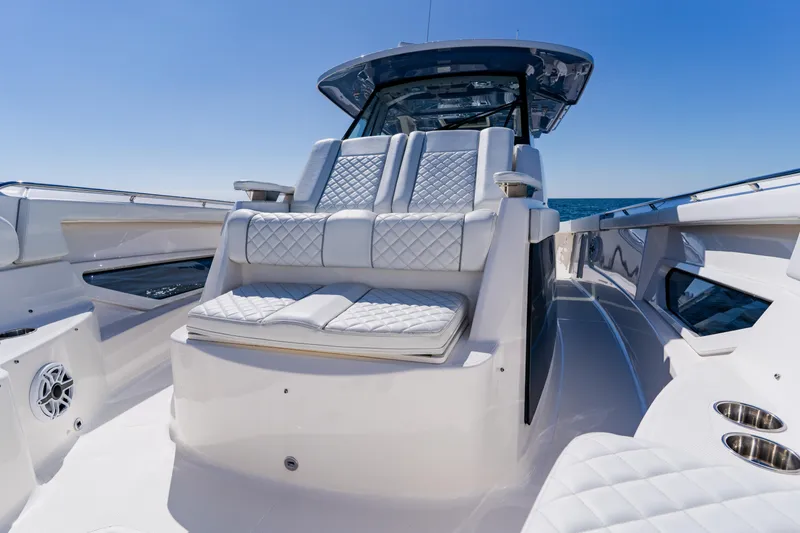 Blue Skies Yacht Photos Pics Luxurious 2022 Pursuit S 378 Sport boat interior with plush seating and sleek design.