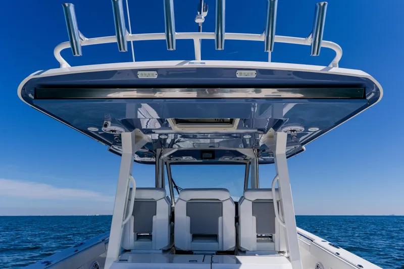 Blue Skies Yacht Photos Pics 2022 Pursuit S 378 Sport boat with sleek design on open water.