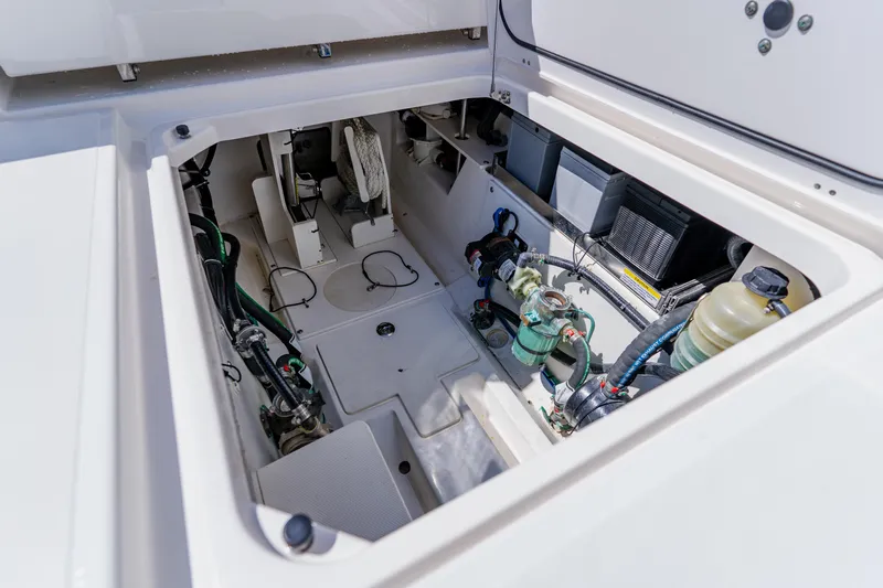 Blue Skies Yacht Photos Pics 2022 Pursuit S 378 Sport boat engine compartment with visible components and wiring.