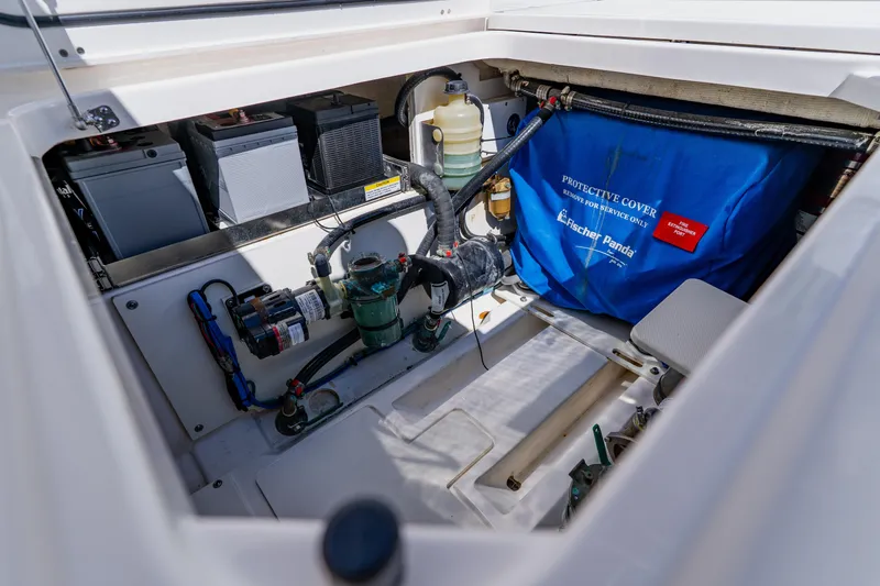 Blue Skies Yacht Photos Pics 2022 Pursuit S 378 Sport engine compartment with batteries and Fischer Panda generator cover.