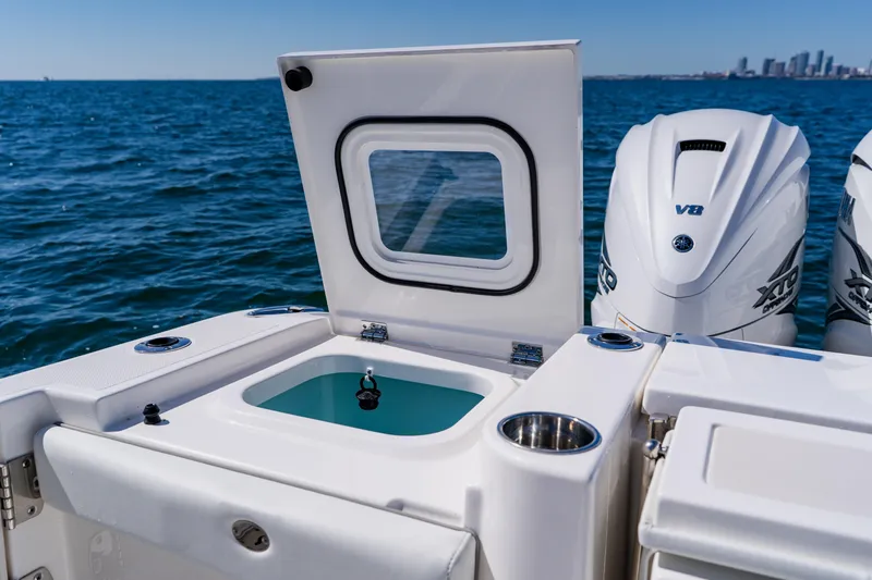 Blue Skies Yacht Photos Pics 2022 Pursuit S 378 Sport boat with open hatch and powerful V8 engines.