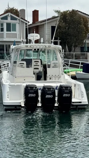  Yacht Photos Pics 2008 Boston Whaler 345 Conquest with triple 250 horsepower engines docked in marina.