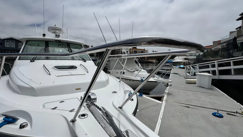  Yacht Photos Pics 2008 Boston Whaler 345 Conquest docked, showcasing sleek design and advanced navigation equipment.