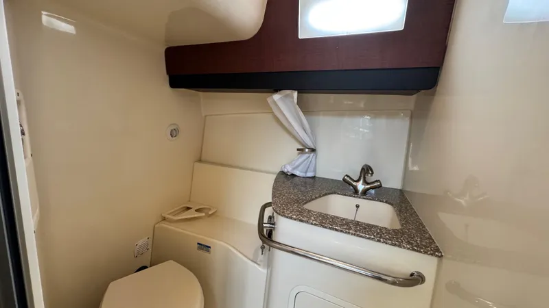  Yacht Photos Pics 2008 Boston Whaler 345 Conquest bathroom with sink, toilet, and window.