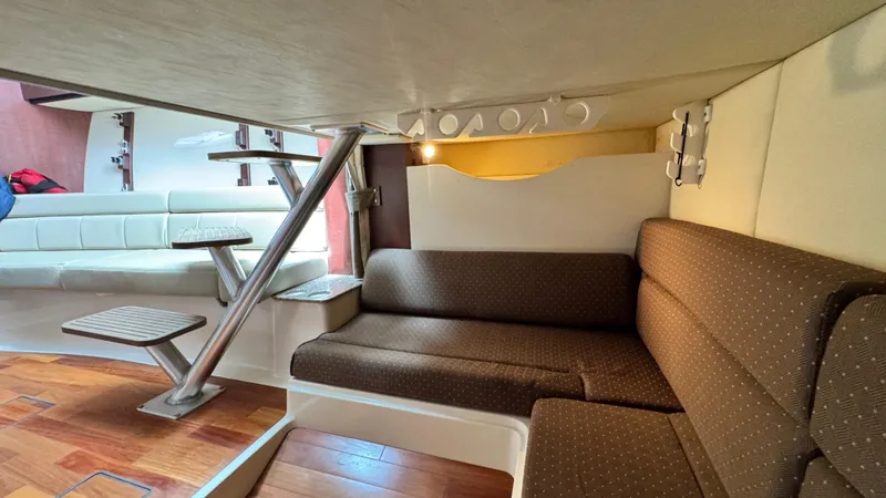  Yacht Photos Pics Interior of 2008 Boston Whaler 345 Conquest with seating and wooden flooring.