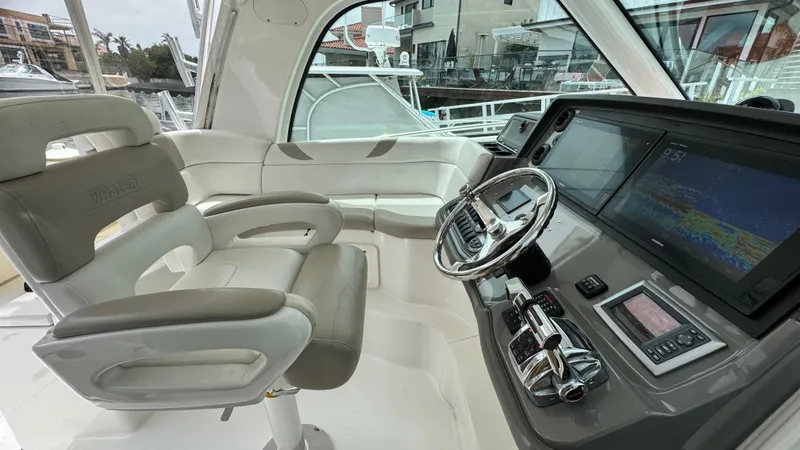  Yacht Photos Pics 2008 Boston Whaler 345 Conquest helm with modern controls and comfortable seating.