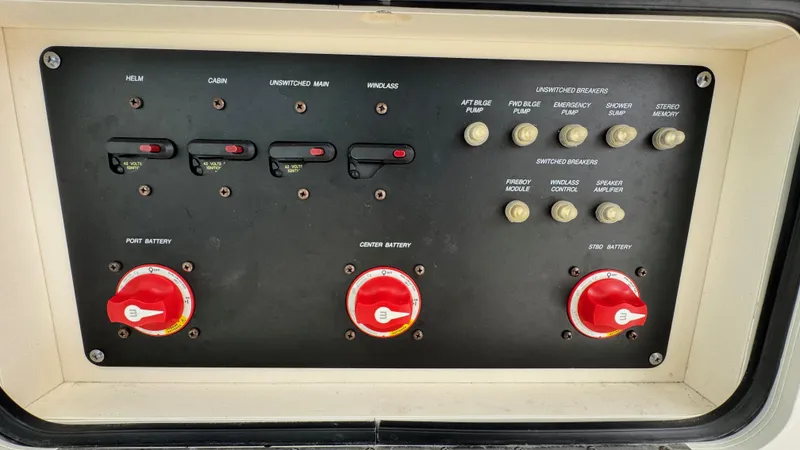  Yacht Photos Pics Control panel of a 2008 Boston Whaler 345 Conquest boat, featuring battery switches and breakers.