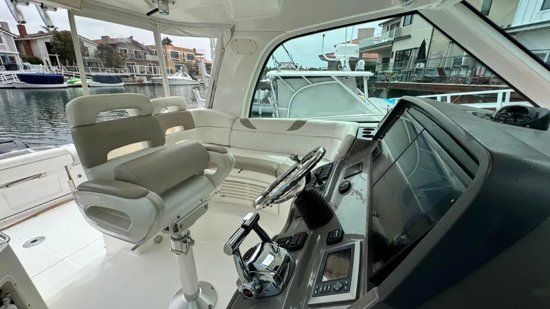 Yacht Photos Pics 2008 Boston Whaler 345 Conquest helm with modern controls and waterfront view.