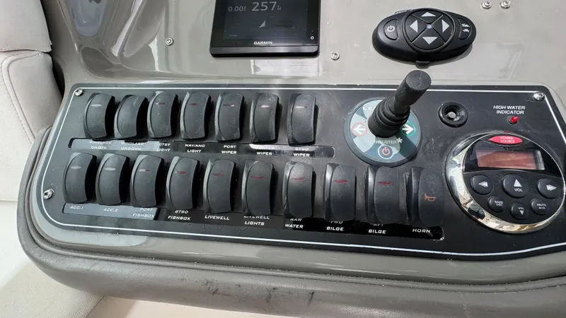  Yacht Photos Pics Control panel of a 2008 Boston Whaler 345 Conquest boat with switches and joystick.