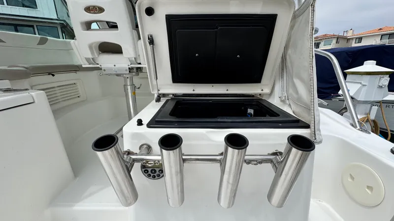  Yacht Photos Pics 2008 Boston Whaler 345 Conquest boat interior with rod holders and storage compartment.