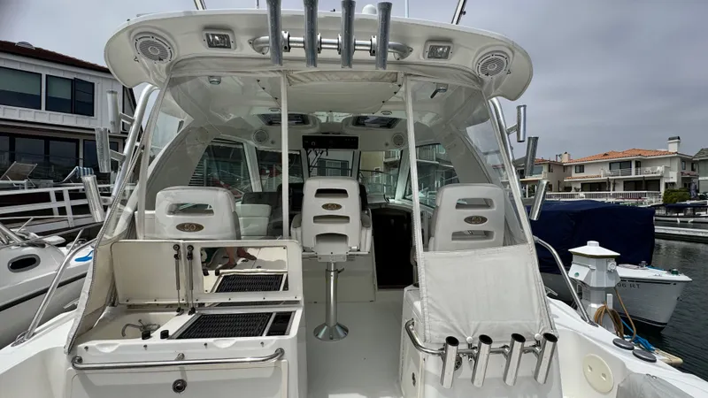  Yacht Photos Pics 2008 Boston Whaler 345 Conquest boat interior with fishing rod holders and seating.