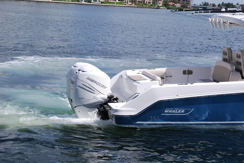  Yacht Photos Pics 2017 Boston Whaler 330 Outrage with Mercury engine on calm water.