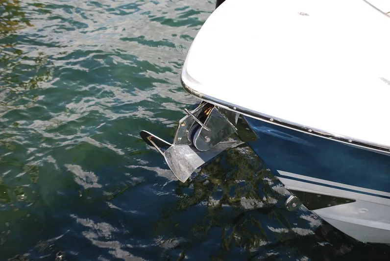  Yacht Photos Pics 2017 Boston Whaler 330 Outrage boat with anchor in water.