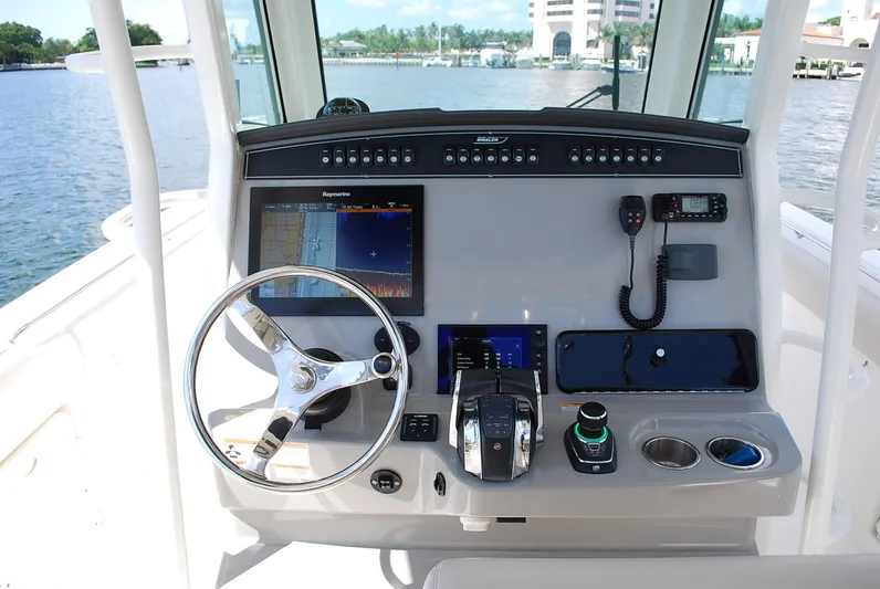  Yacht Photos Pics 2017 Boston Whaler 330 Outrage helm with advanced navigation and control systems.