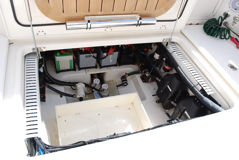  Yacht Photos Pics 2017 Boston Whaler 330 Outrage engine compartment with batteries and wiring.