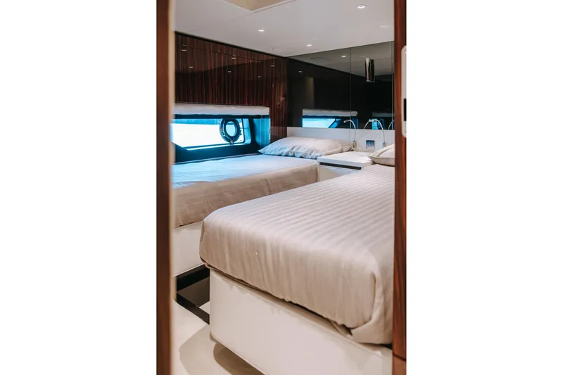  Yacht Photos Pics Luxurious bedroom interior of 2022 Riva 82' Diva yacht with twin beds.